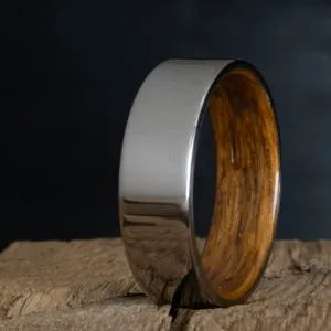 Classic titanium wedding band with whiskey barrel wood