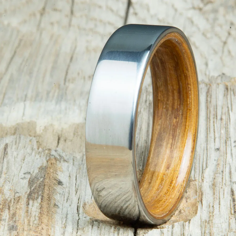Classic titanium wedding band with whiskey barrel wood