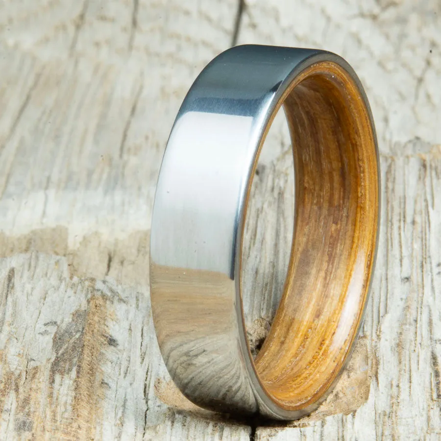 Classic titanium wedding band with whiskey barrel wood
