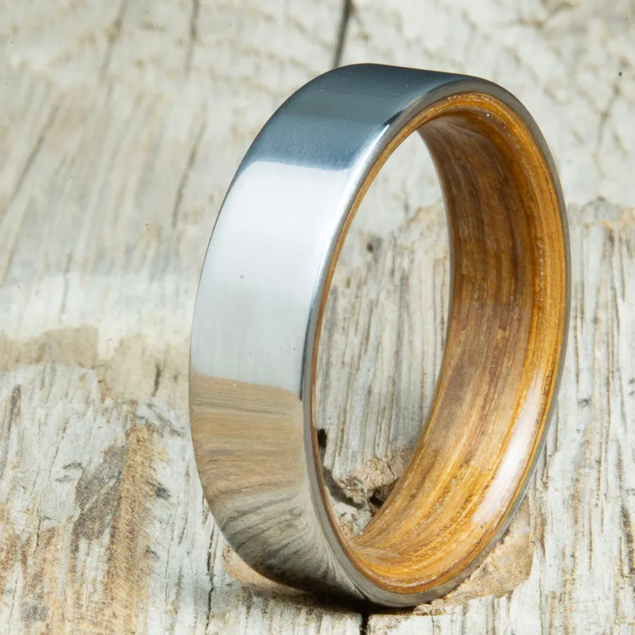 Classic titanium wedding band with whiskey barrel wood