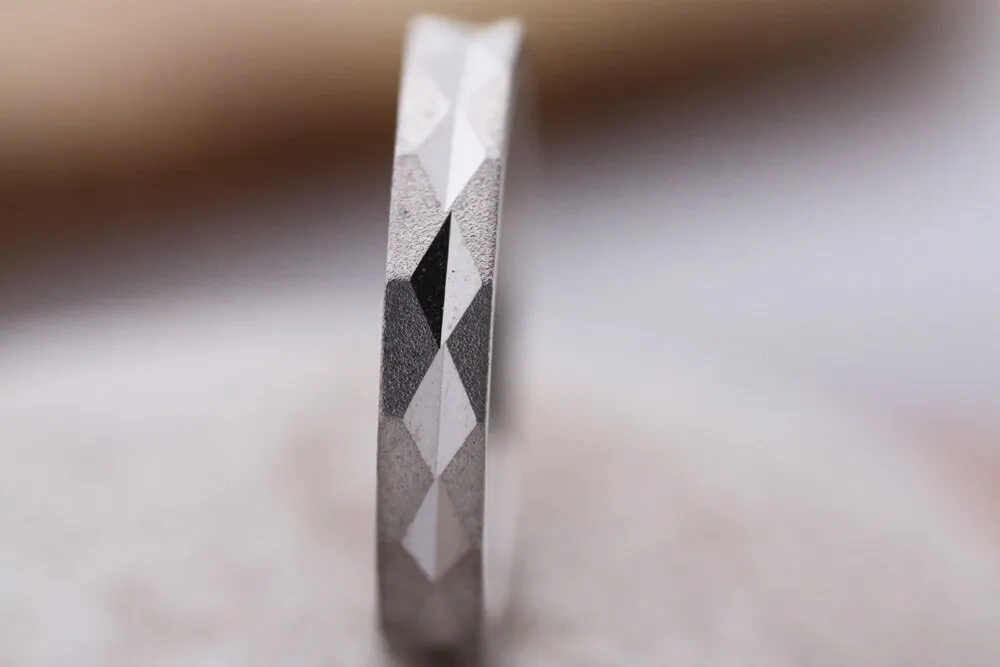 Faceted gold wedding band