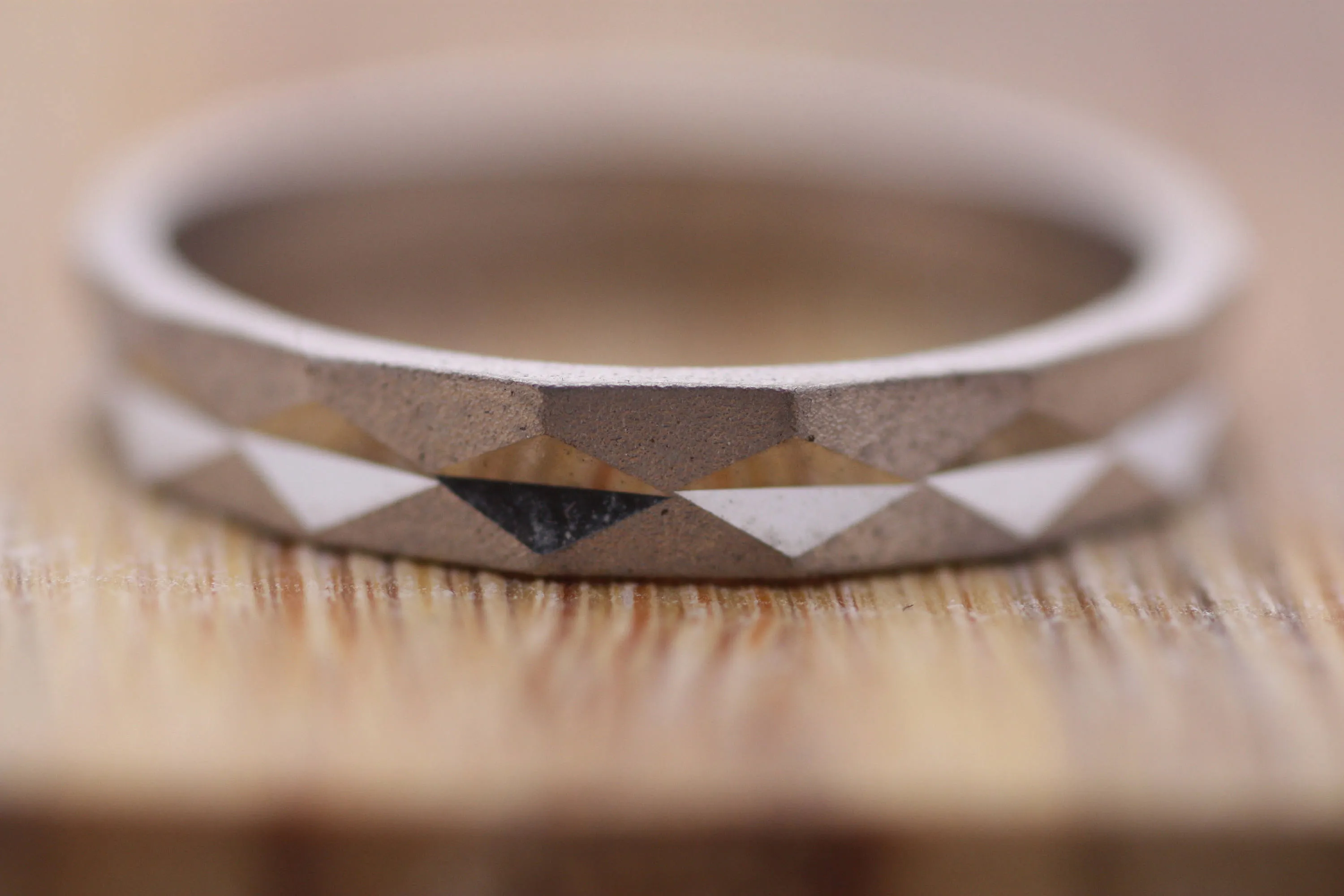 Faceted gold wedding band