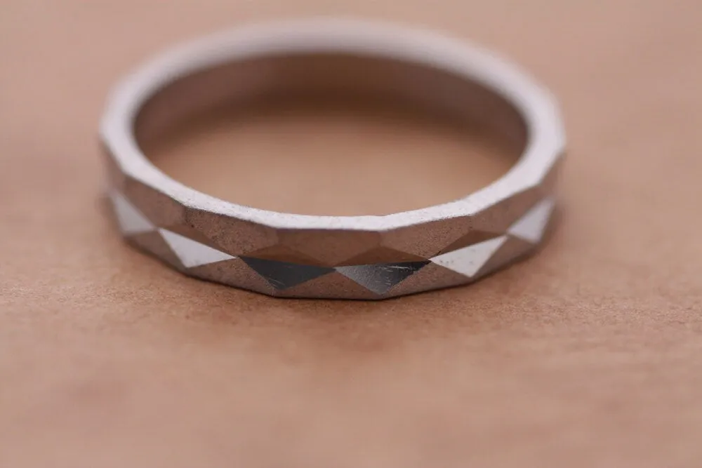 Faceted gold wedding band